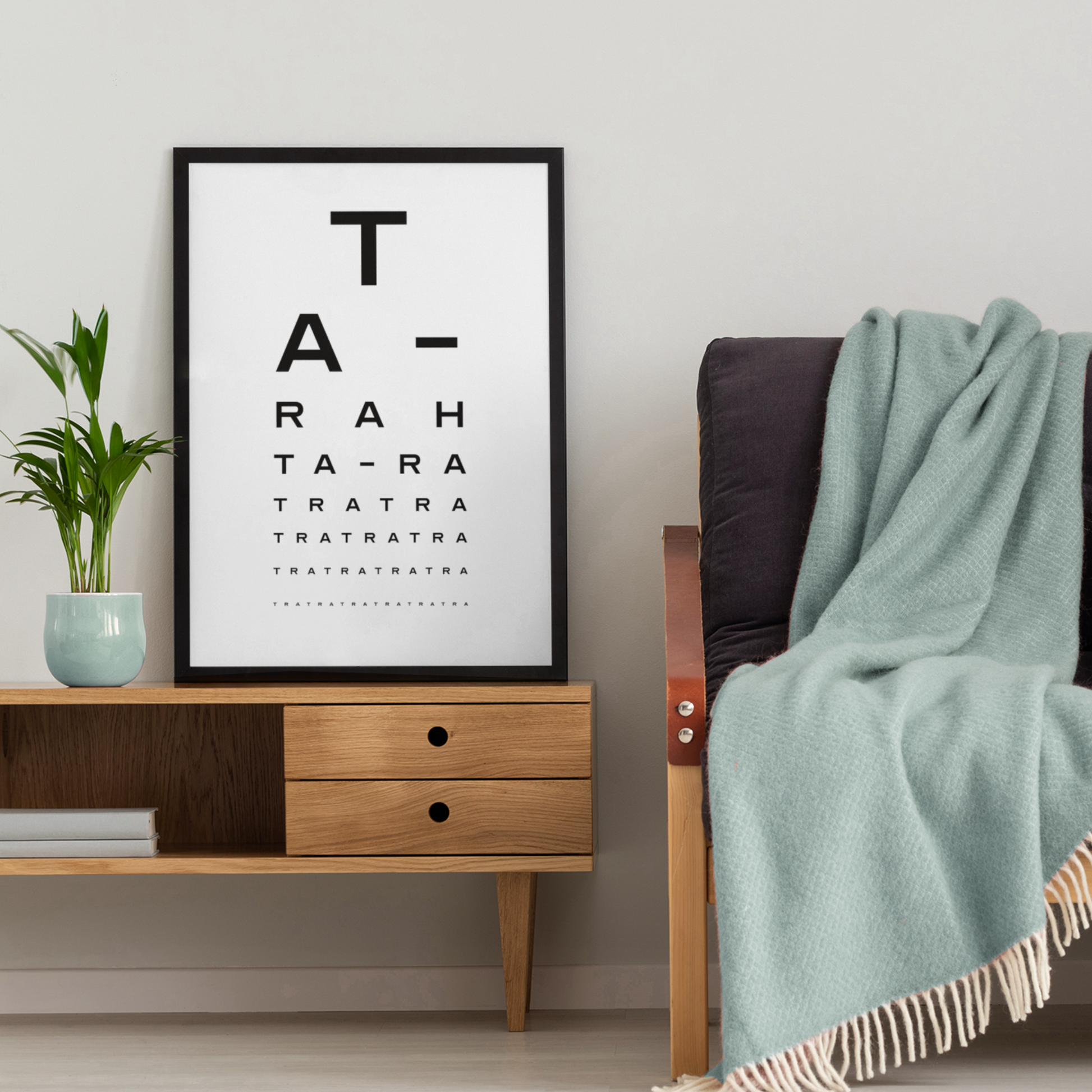 Framed “Ta-Ra” Liverpool art print by Lapskaus, designed in an eye test style, displayed in a cosy home setting with Scandinavian décor – perfect for lovers of Scouse culture and design.