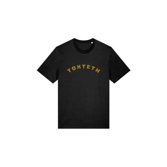 Black t-shirt with arched 'TOXTETH' text in Lapskaus Mustard print on a white background